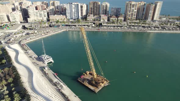 Top down view towards to floating crane platform on Malaga harbor, Spain