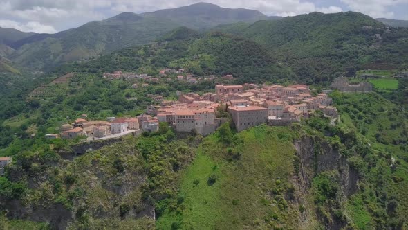 Aerial Medieval Village on Cliff Overlooking Mountain Gorge, Old Town Buildings with Red Tile Roofs