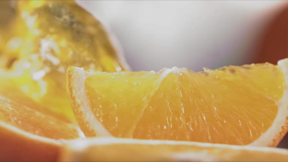 Slow Motion Shot of Orange Juice Splashing Through Orange Slices at 1400Fps alt