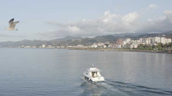 Trabzon City Mountains Sea And Following Speed Boat Aerial View 4