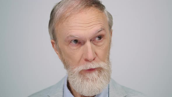 Serious Man Posing to Camera in Studio alt