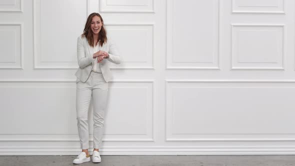 Laughing Businesswoman in White