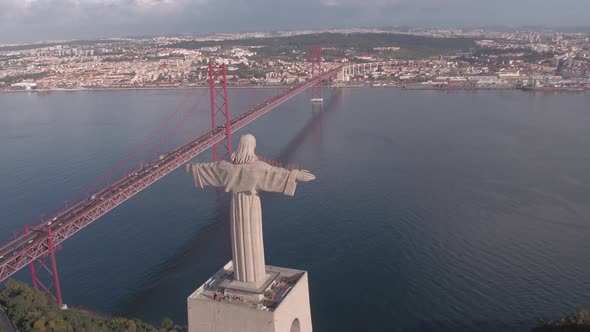 Aerial of the Christ statue near 25 de Abril Bridge