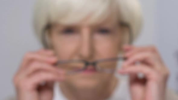 Elderly Lady Wearing Eye Glasses Cheerfully Smiling at Camera, Vision Care alt