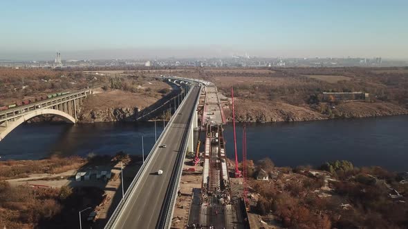 Construction of the bridge, Zaporozhye, Ukraine, view from the air. Drone aerial high angle view. alt