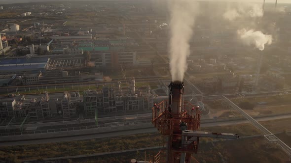 Aerial View. In the Frame Is a Chemical Industrial Complex. Poisonous Smoke Comes Out of the Chimney alt