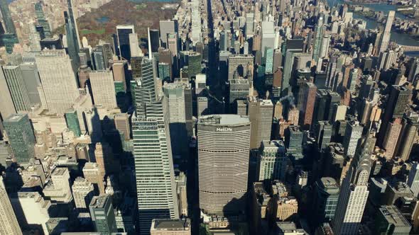 High Angle View of Tall Skyscrapers in Midtown Lit By Bright Sun alt