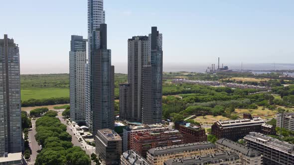 Aerial orbiting shot of Buenos Aires skyline, the Ecological Reserve and La Plata river alt