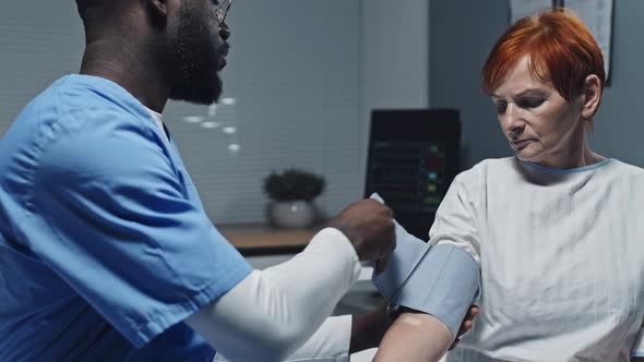 Nurse Measuring Pressure of Patient alt