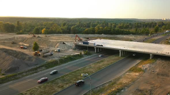 Construction of a Road Junction with a Bridge Over the Road Outside the City Evening Time Beautiful