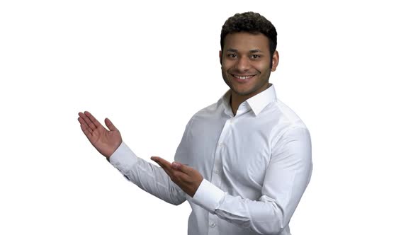 Successful Indian Businessman Pointing on Empty Copy Space alt