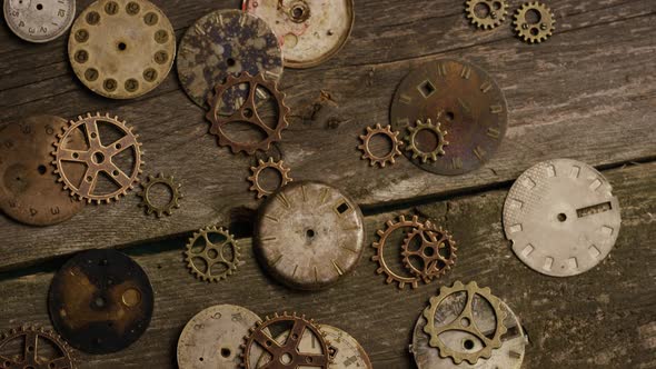 Rotating stock footage shot of antique and weathered watch faces alt