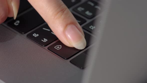 close-up female hand pressing a Backspace key for delete on a laptop keyboard alt