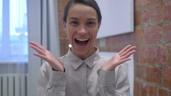 Amazed Hispanic Woman, Happy by Positive Surprise alt