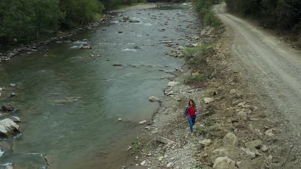 Tourist Walking Rocky River Drone View at Cloudy Cold Day Having Fun Mountains alt