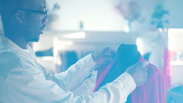 Fabric on the Mannequin is Getting Touched By a Designer alt