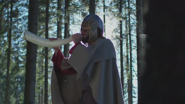 Warrior playing the war horn alt