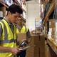 Worker scanning products with a barcode scanner