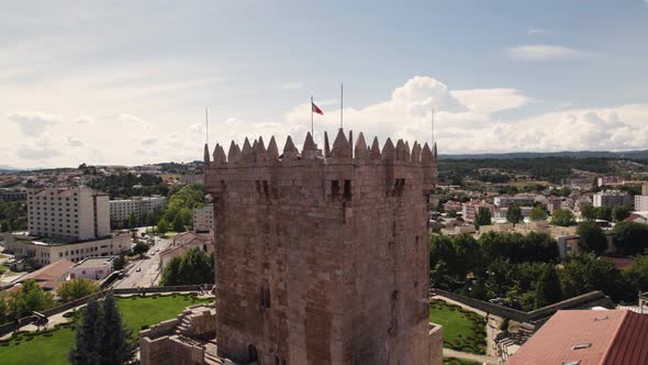 Aerial orbiting around Homage tower of Chaves medieval castle in Portugal alt