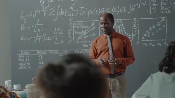 Professor Speaking to Students during Math Class alt