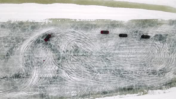 Drone Aerial View of Training Circuit on Frozen Lake with Sport Cars Training on It Before alt