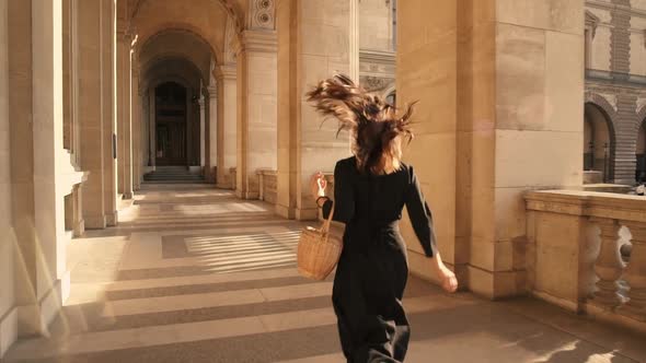Slow Motion of Woman in Black Dress Running Outdoors in Paris