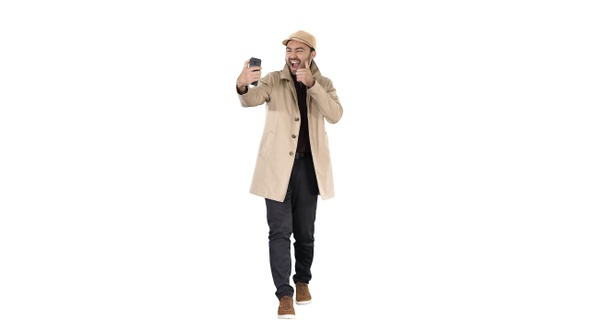 Cheerful Man in Coat Taking Photo Making Selfie on White alt
