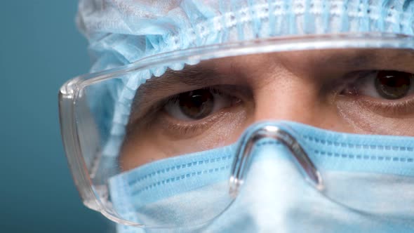 Doctor Face, Eyes in Safety Glasses. Portrait Medical Male Wearing Protection and Eyeglasses in