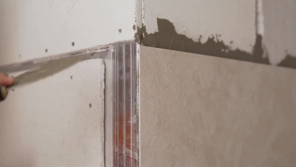 The Bathroom Tiles Were Glued To the Wall. Master Glues Bathroom Tiles. The Tiles Were Glued To the alt