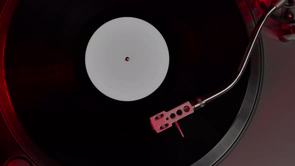 Black Vinyl Record Spinning on Turntable LP Player in Motion Top View