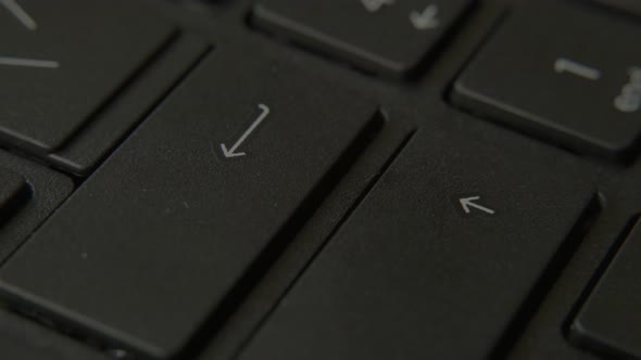 The Finger Presses the Enter Button on the Keyboard alt