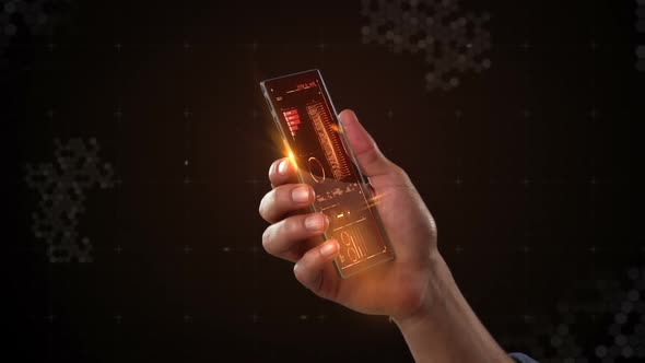 Hand holding futuristic mobile phone against digitally generated background alt