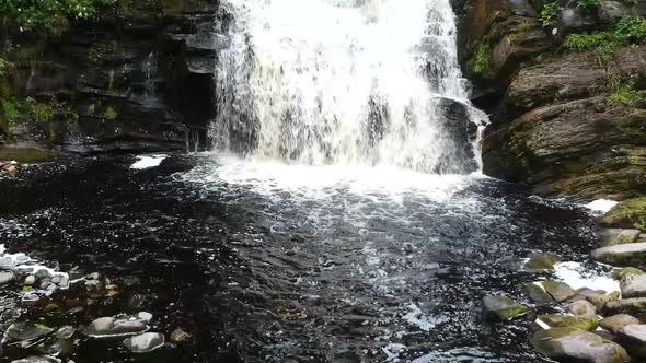 Waterfall in the Green Forest and Black Water alt