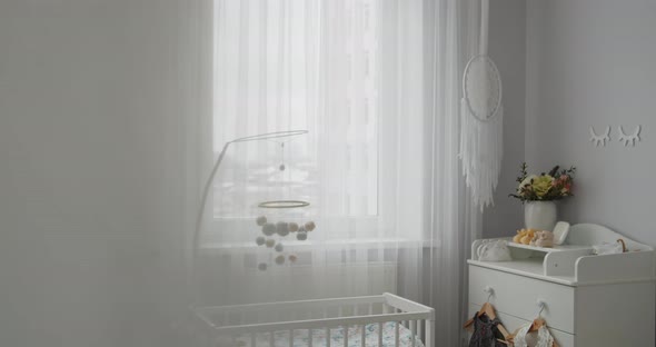 Stylish Bright Modern Baby Room Interior Crib Hanging Mobile Changing Table alt