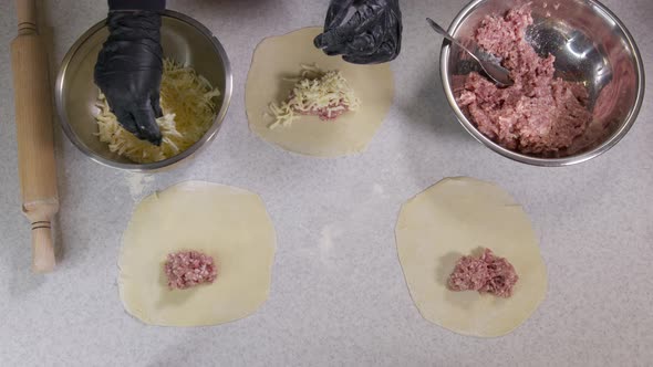 Closeup Shot of Hands in Black Gloves Bakery Chef Applying Flour on Dough Isolated Background alt
