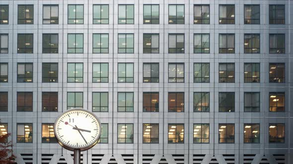 Timelapse of a clock with a modern office behind