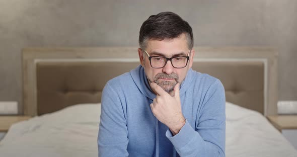 Serious Look at Camera Senior Man Frustrated Upset By Bad News Emotionless Apathy Depression Sitting alt