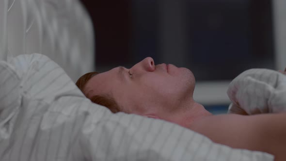 Man goes to bed at night, covers himself with a blanket, healthy sleep concept alt