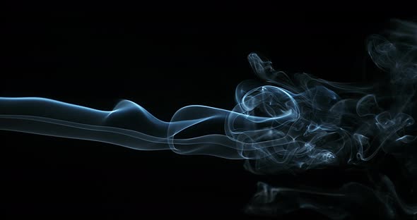Smoke of Cigarette rising against Black Background, Slow Motion 4K alt