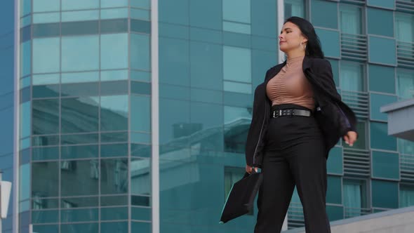 Stressed Young Businesswoman Walks Anxiously Waiting for Meeting Waits for Taxi with Annoyance Looks alt