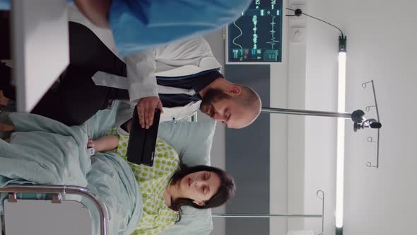 Vertical Video Practitioner Doctor Explaining Disease Diagnosis to Sick Woman alt