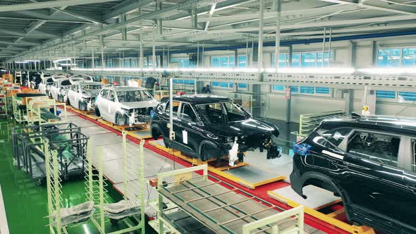 Automobile, Car Factory Conveyor, Factory Premises with Multiple Unfinished Automobile alt