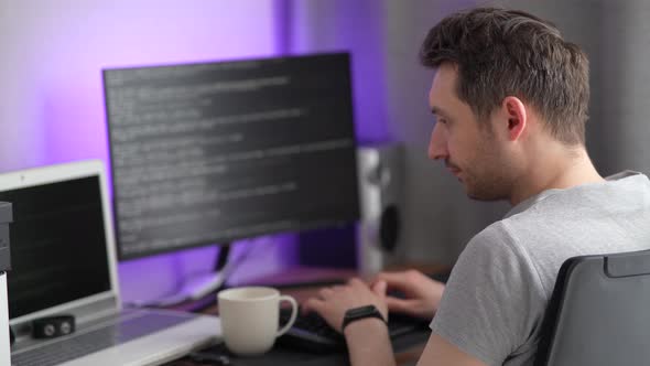 Male Programmer Working at Home