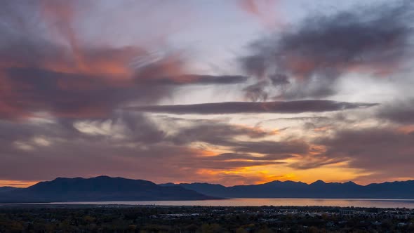 Timelapse during sunset looking over Provo as clouds change colors alt