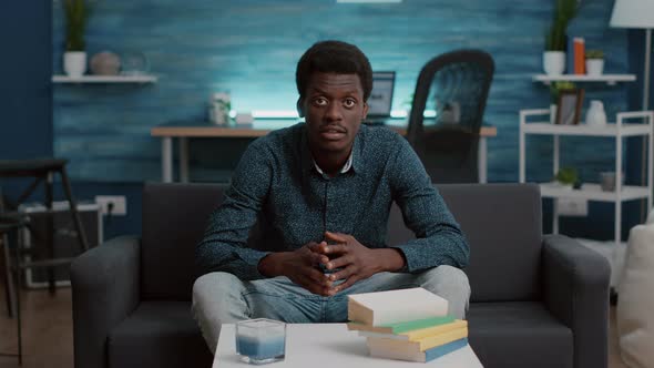 POV Man Greeting and Talking with His Colleagues on Online Internet Video Conference Call alt