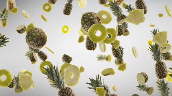 Pineapples with Slices Falling on Grey Background alt