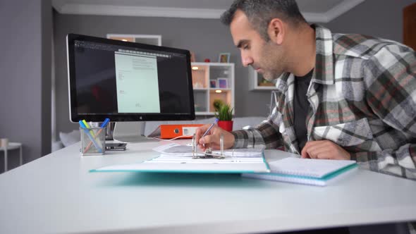 Man working in home office. alt
