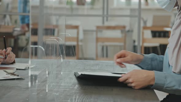 Muslim Woman Singing Contract at Job Interview alt