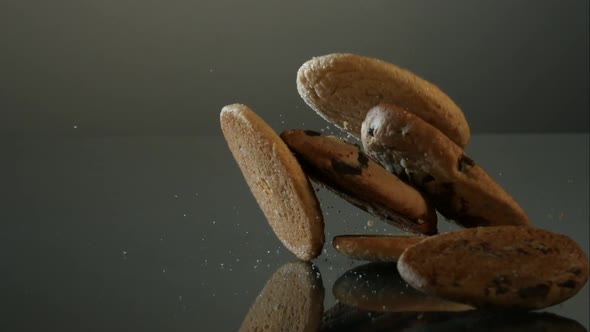 Cookies falling and bouncing in ultra slow motion  alt