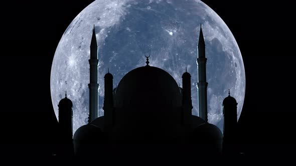 A large moon rises over the mosque during Ramada